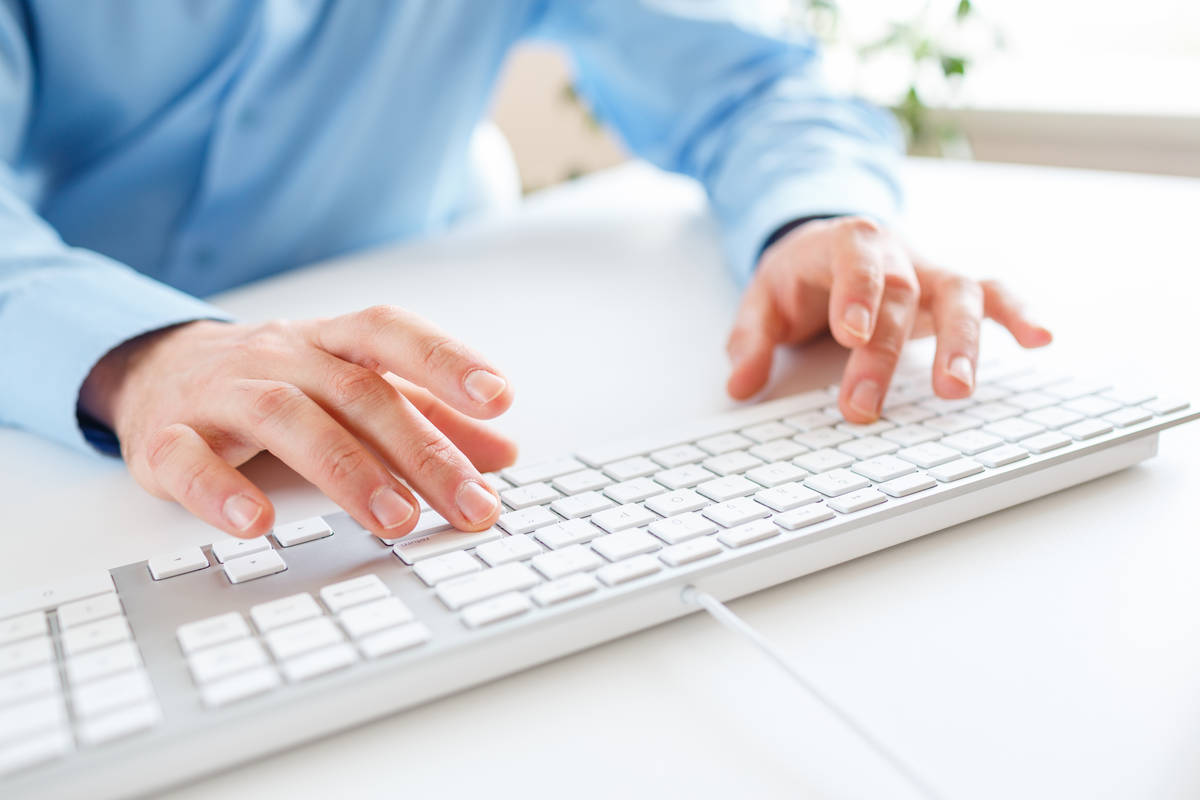 Male hands or men office worker typing on the keyboard