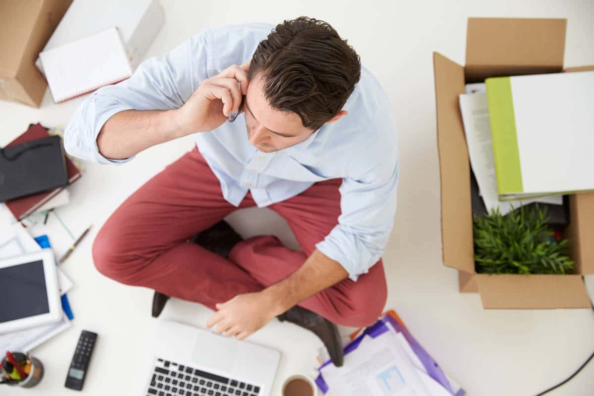 Overhead View Of Start Up Business Moving Into Office