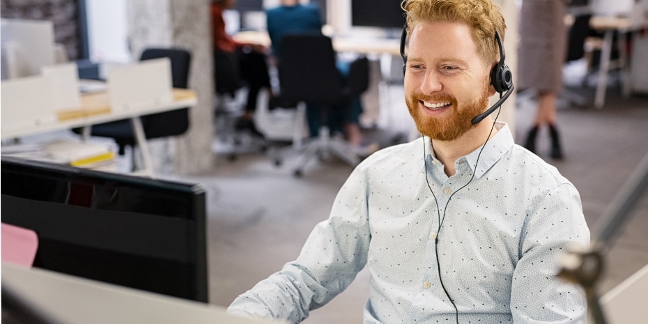 man using voip phone call in office